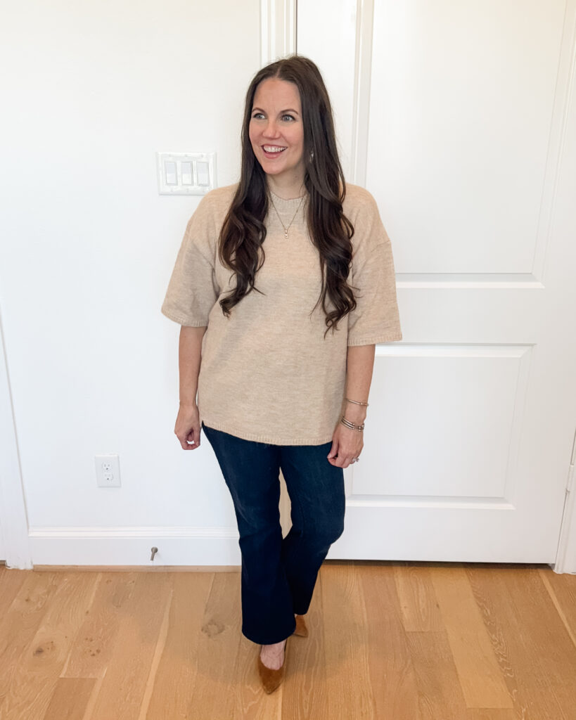 dressy casual fall outfit | light tan short sleeve sweater | dark blue bootcut jeans | Houston Fashion Influencer Lady in Violet